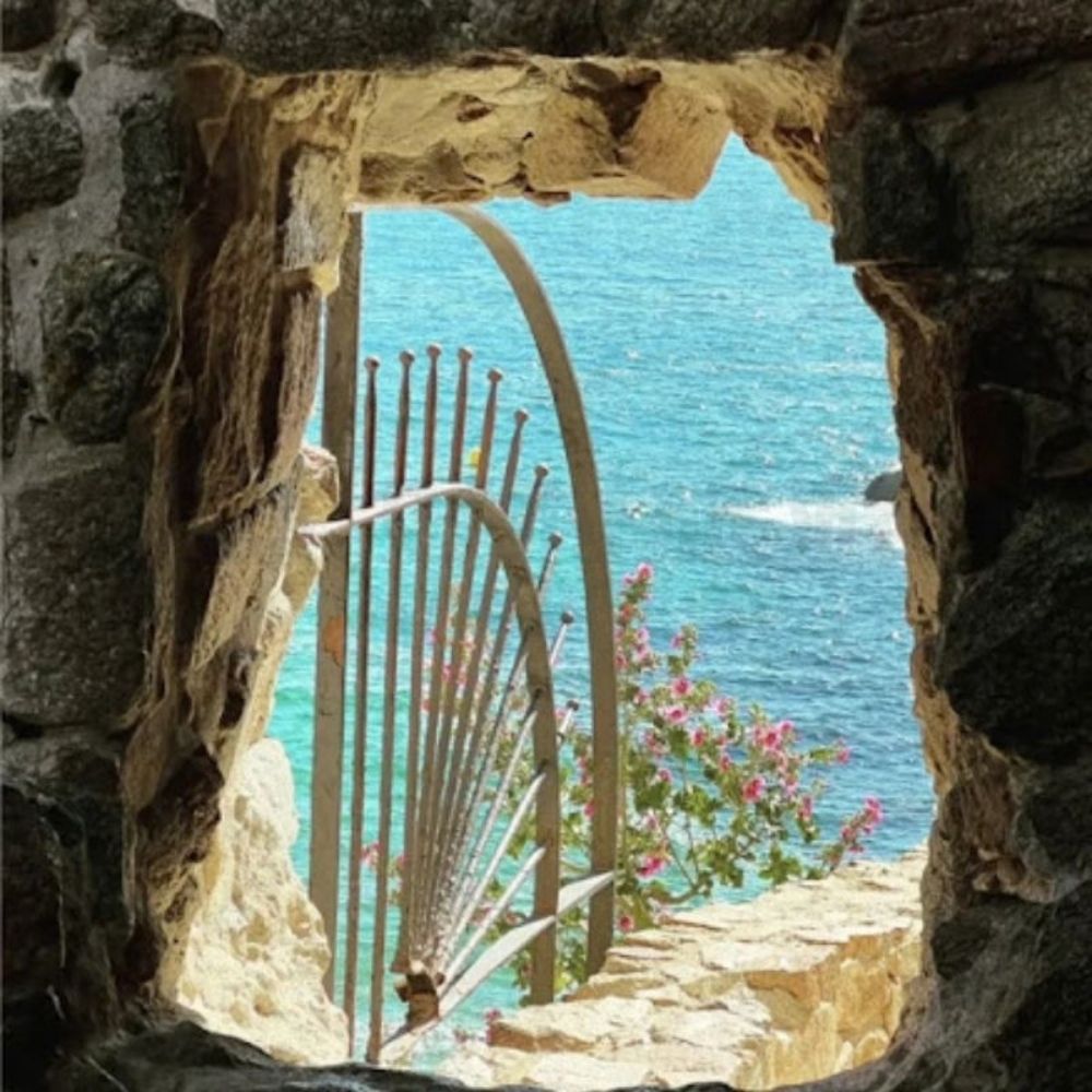Sea view through the medieval stone walls of Tossa de Mar